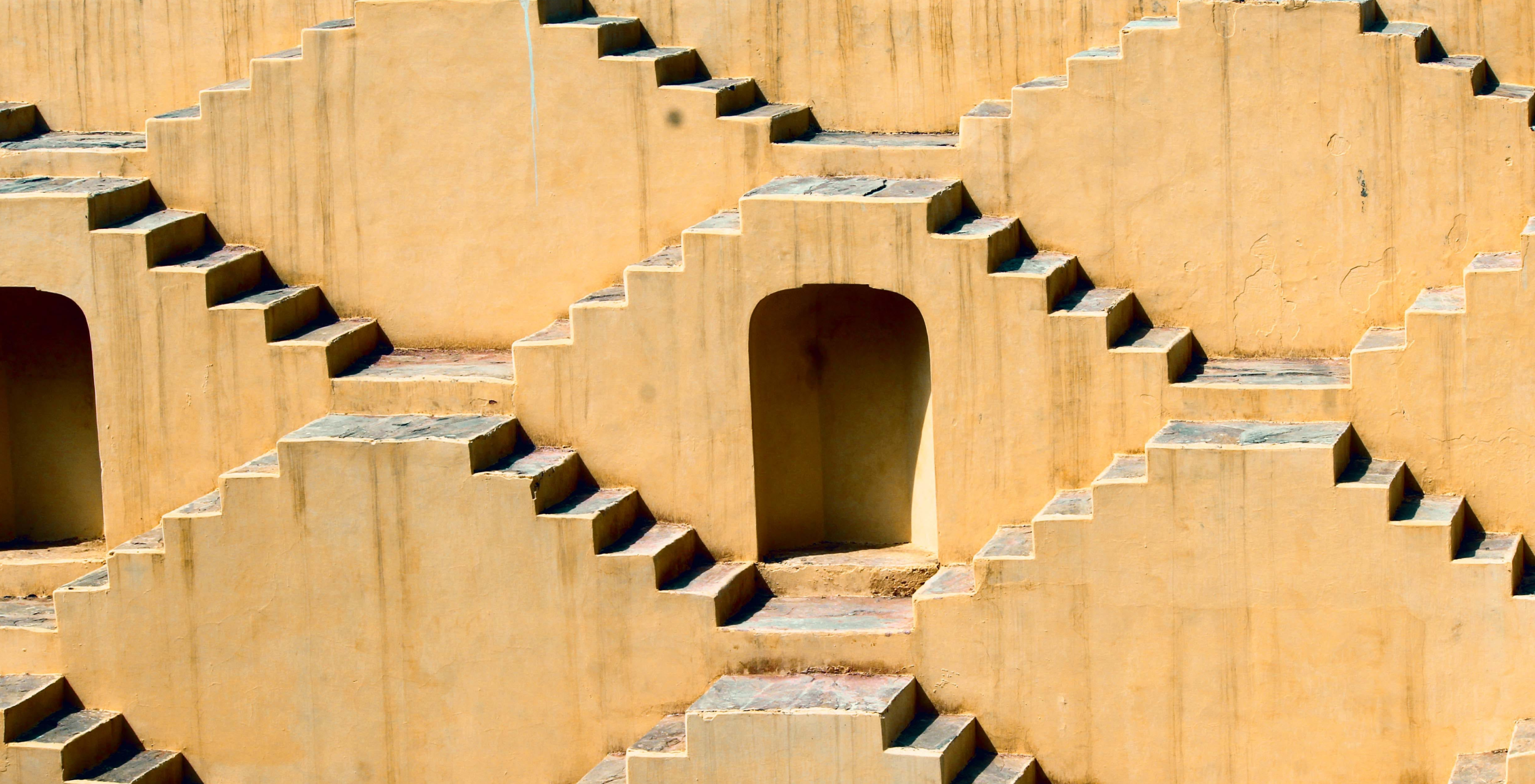 Pattern of staircases and doors in a desert landscape